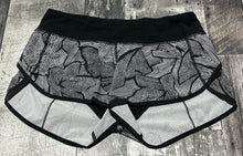 Load image into Gallery viewer, lululemon black/white shorts - Hers size 6
