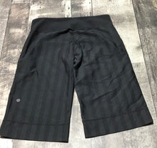 Load image into Gallery viewer, lululemon black wide leg capri - Hers size approx M

