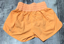 Load image into Gallery viewer, lululemon orange shorts - Hers size 4
