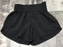 Load image into Gallery viewer, lululemon black athletic shorts - Hers size 4
