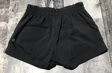 Load image into Gallery viewer, lululemon black shorts - Hers size 4
