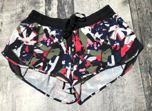 Load image into Gallery viewer, lululemon black/blue/green/red athletic shorts - Hers size 4
