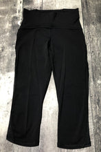 Load image into Gallery viewer, lululemon black mid rise capri leggings - Hers size 4
