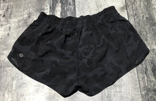 Load image into Gallery viewer, lululemon black/grey shorts - Hers size 6
