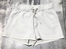 Load image into Gallery viewer, lululemon off white athletic shorts - Hers size 4
