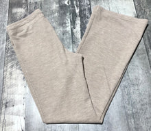 Load image into Gallery viewer, TNA beige flare lounge pants - Hers size M
