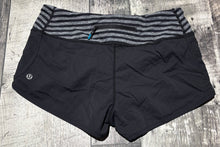 Load image into Gallery viewer, lululemon black/grey shorts - Hers size 6
