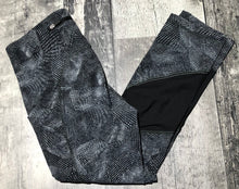 Load image into Gallery viewer, lululemon black/grey/white capri leggings - Hers size 4
