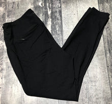 Load image into Gallery viewer, The North Face black mid rise skinny pants - Hers size L
