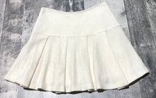 Load image into Gallery viewer, BCBG cream mini skirt - Hers size 2
