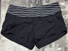 Load image into Gallery viewer, lululemon black/grey shorts - Hers size 6
