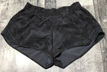 Load image into Gallery viewer, lululemon black/grey shorts - Hers size 6
