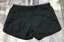 Load image into Gallery viewer, lululemon black/grey shorts - Hers size 4
