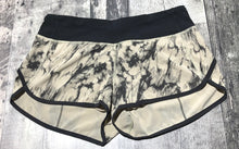 Load image into Gallery viewer, lululemon black/cream athletic shorts - Hers size 6

