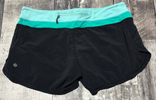 Load image into Gallery viewer, lululemon black/teal shorts - Hers size 10
