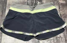 Load image into Gallery viewer, lululemon black/green/grey shorts - Hers size 10
