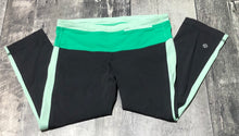 Load image into Gallery viewer, lululemon black/green/mint cropped leggings - Hers size 6

