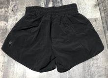 Load image into Gallery viewer, lululemon black athletic shorts - Hers size 4
