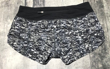 Load image into Gallery viewer, lululemon grey/black/white athletic shorts - Hers size 4
