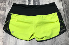Load image into Gallery viewer, lululemon black/neon yellow shorts - Hers size 6

