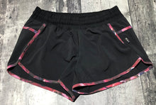 Load image into Gallery viewer, lululemon black/red shorts - Hers size 8
