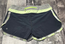Load image into Gallery viewer, lululemon black/green/grey shorts - Hers size 10
