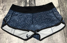 Load image into Gallery viewer, lululemon blue/black shorts - Hers size 4
