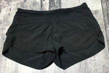 Load image into Gallery viewer, lululemon black athletic shorts - Hers size 4
