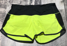 Load image into Gallery viewer, lululemon black/neon yellow shorts - Hers size 6

