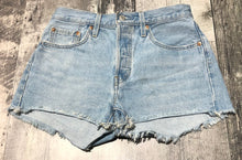 Load image into Gallery viewer, Levi light blue button fly high rise denim shorts - Hers size 27 we
