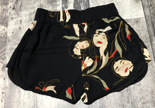 Load image into Gallery viewer, Little Moon black/cream/green/red shorts - Hers size XS
